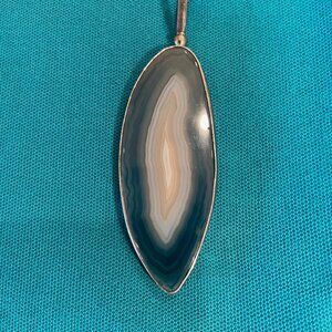 Obsidian drop framed in silver